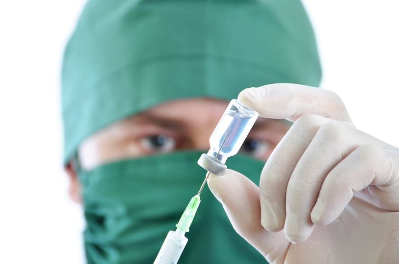 vaccine being held by a doctor