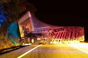 Large truck accident with a flipped over truck