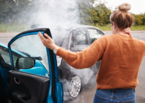 woman holding her neck following a car crash caused by distracted driving