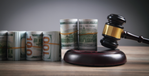 money and a gavel for receiving personal injury compensation from trucking accidents