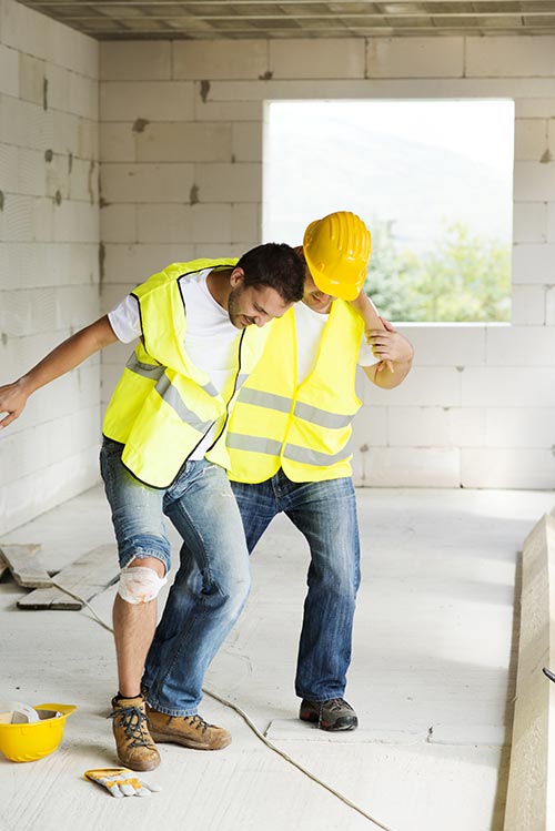 construction worker helping an injured construction worker