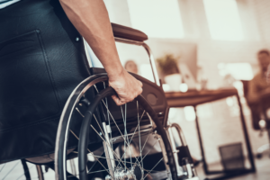 injury lawyer in North Miami helps person in a wheelchair recover damages from the other party.