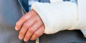 a person with a sling suffering from wrist injury, spinal cord injury from his terrible car accident