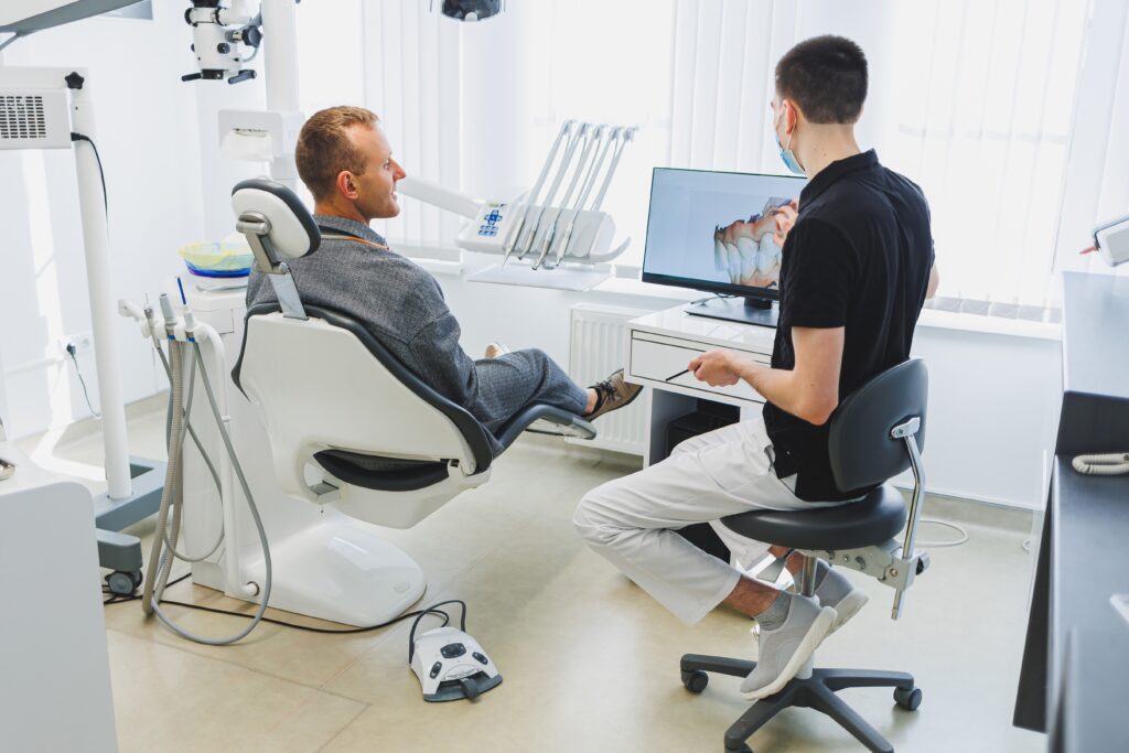 a dentist talking with a patient