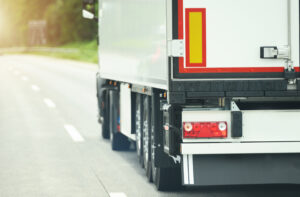 Products Ground Shipping Using Semi Truck Cargo Transportation. Trucking and Transportation Theme.