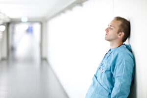a doctor in a hallway after committing medical malpractice in Key Biscayne, FL