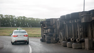 A view of an overturned truck on an highway in an accident.